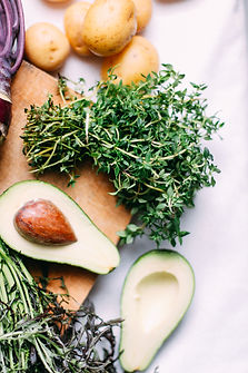 Thyme and avocado on a cutting board
