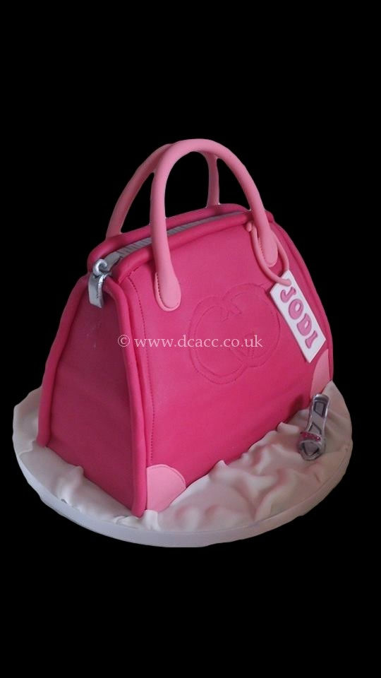 Pink Gucci handbag shaped birthday cake.jpg