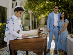 Sephardic family practicing Bar Mitzvah Torah reading