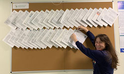 Madison hangs up her new paper