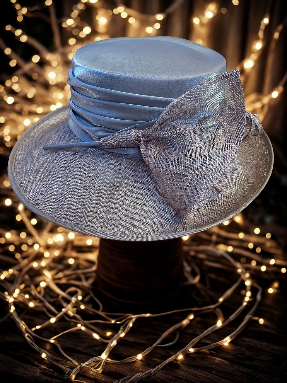 Thumbnail: Bronte - Bronze and silver satin and woven hat with unusual scroll detail
