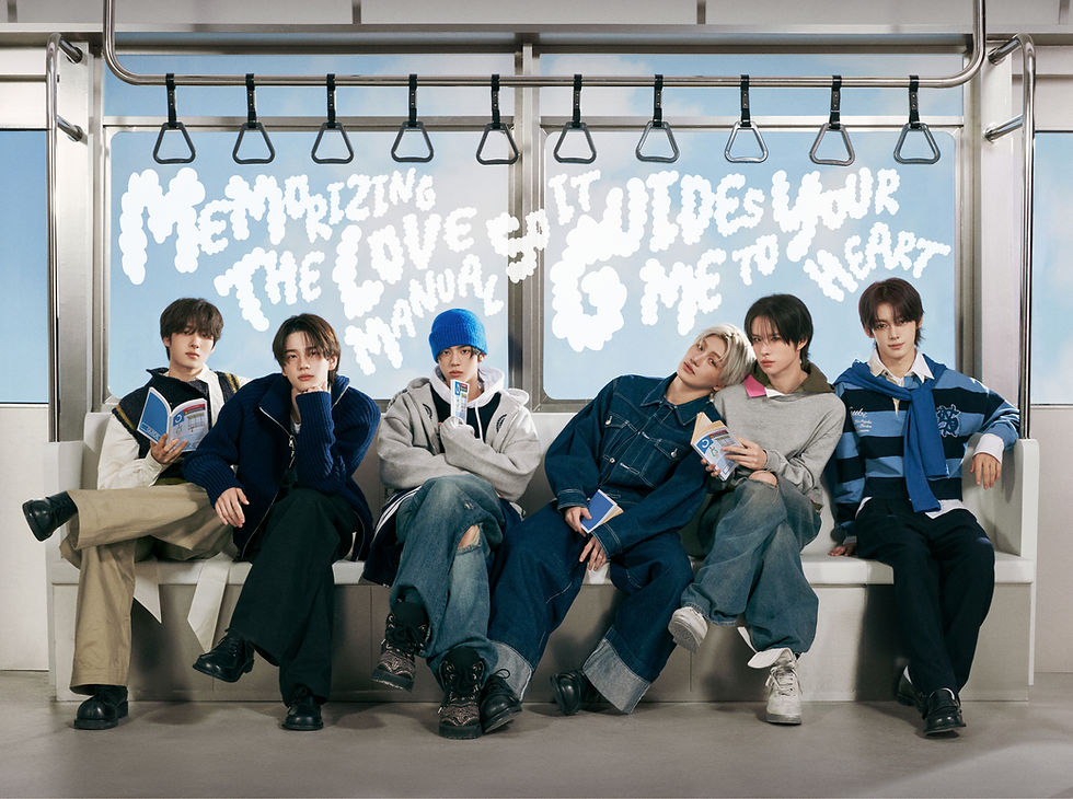 6 members of TWS sitting on a subway train bench with "Memorizing the love manual so it guides me to your heart" written in a cloud style font on the window behind them