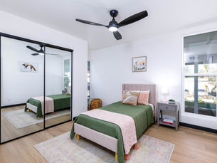 A photograph of a beautifully staged bedroom shot for a real estate sales listing