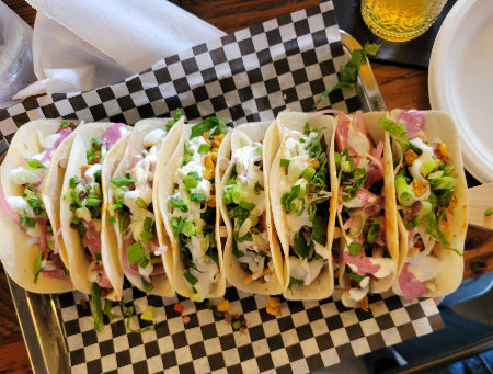 Paddle of 8 custom loaded tacos at TACOcentric Downtown Kentville, NS