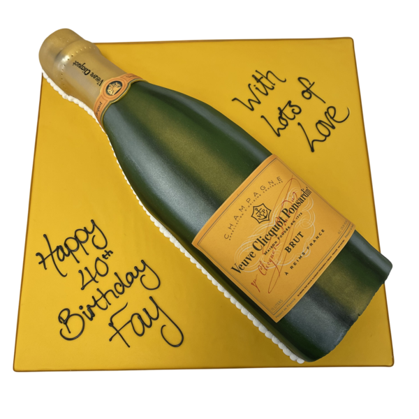 Luxurious champagne bottle-shaped cake with intricate detail and elegant gold accents, perfect for special occasions and celebrations.