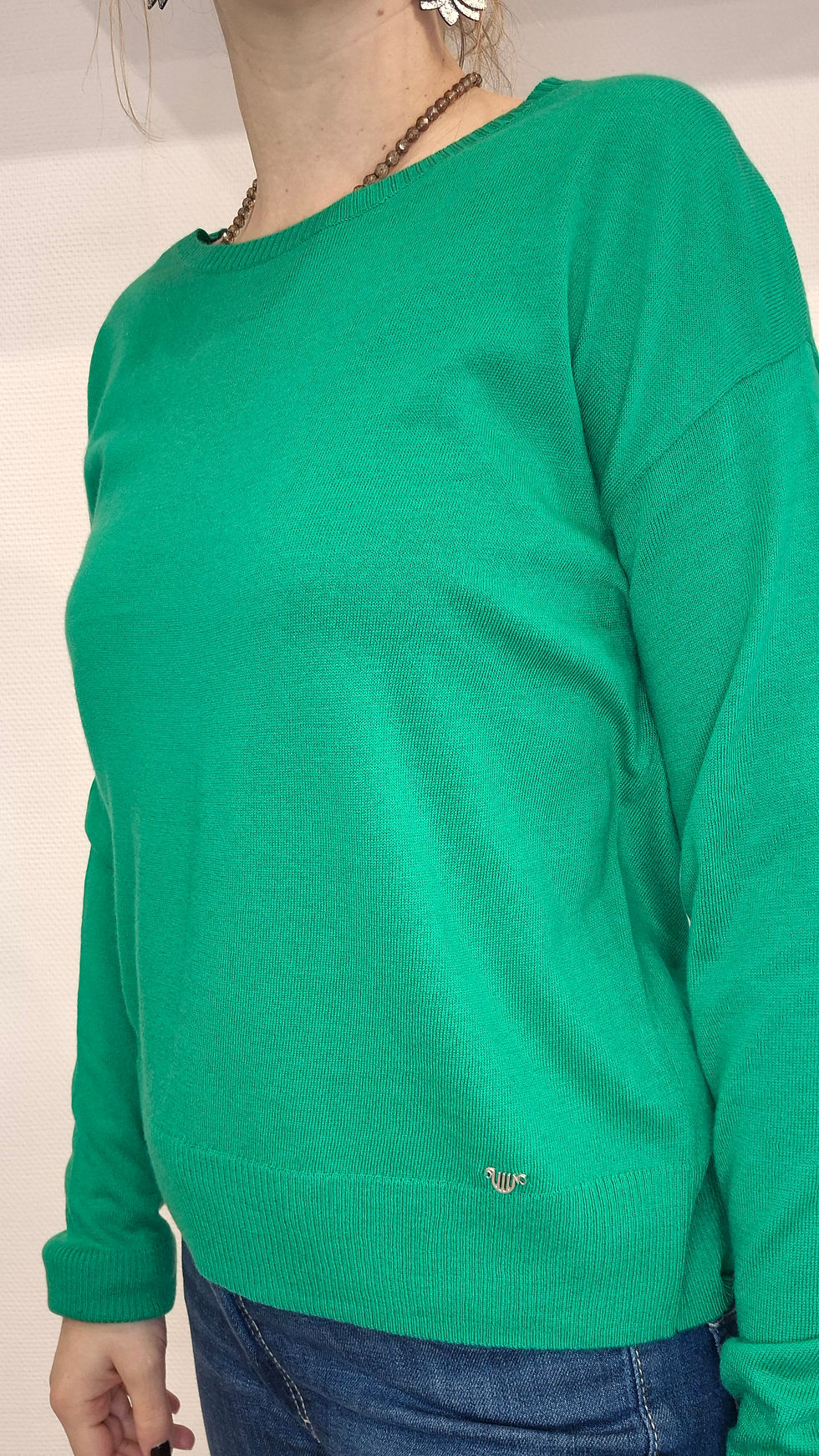 Miniature : Détail de la maille fine du pull vert