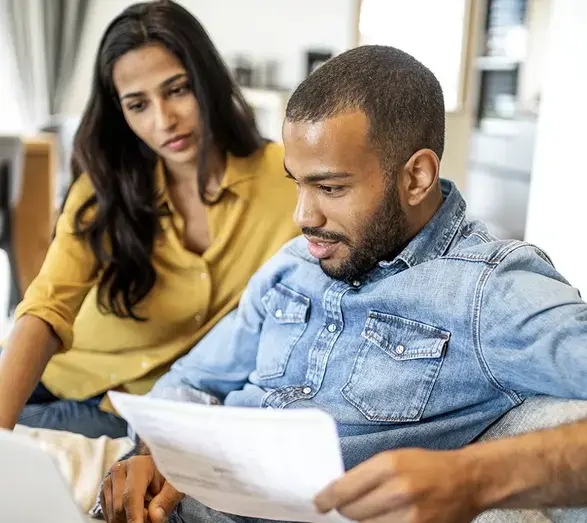 iStock-1397496424-couple-reviews-paperwork.webp