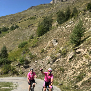 cyclists riding up mountain
