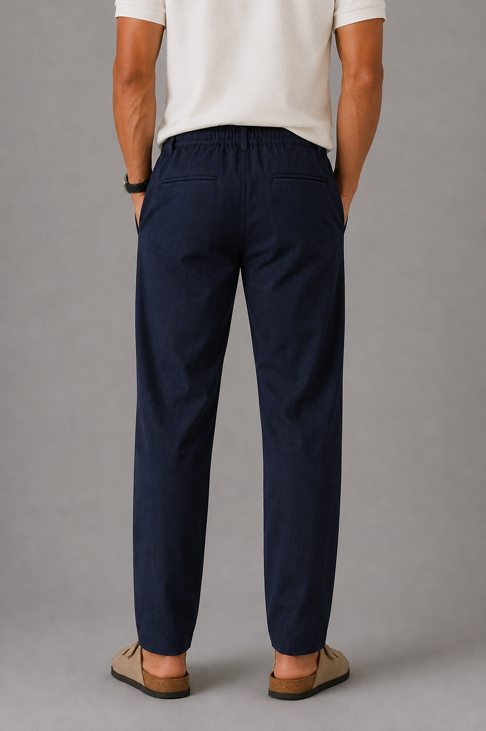 Thumbnail: Blue cotton linen trousers back view with welt pockets and lightly gathered waistband