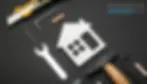 White house icon surrounded by tools, representing repairs due to property wear and tear.