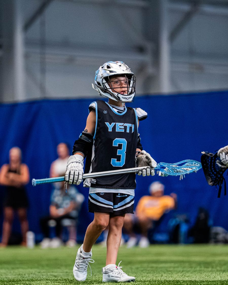 Young Yeti player in a black number 3 jersey