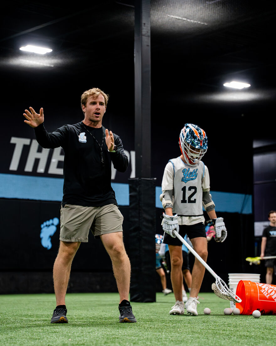 Yeti coach running an indoor drill
