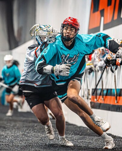 Yeti players battling on indoor turf