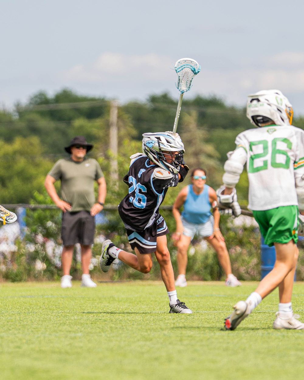 Young Yeti player dodging a defender in a league game