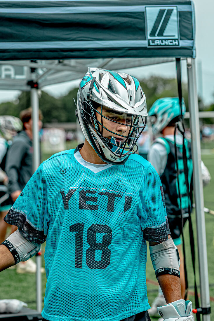 Yeti high school player number 18 in a teal jersey