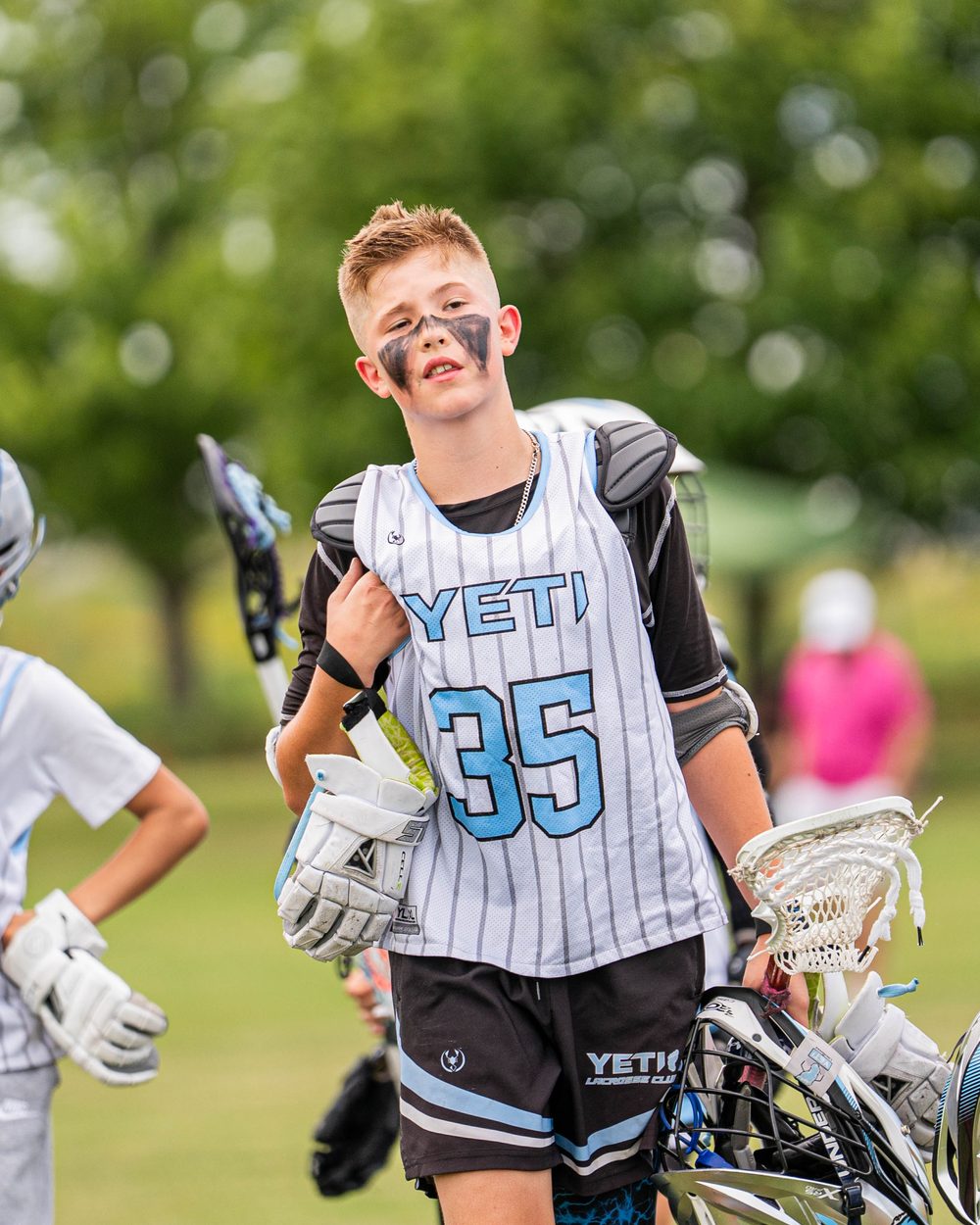 Smiling young Yeti player in a striped number 35 jersey