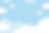 A background of a vibrant blue sky with clusters of white cartoon clouds