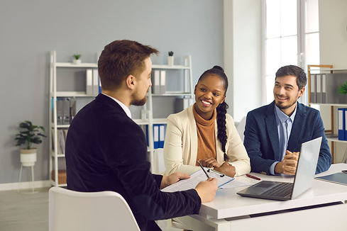 Financial manager, realtor or insurer consulting clients, interviewing interracial couple
