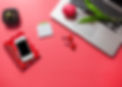 tulips-laptop-cactus-stationeries-with-smartphone-red-background.jpg