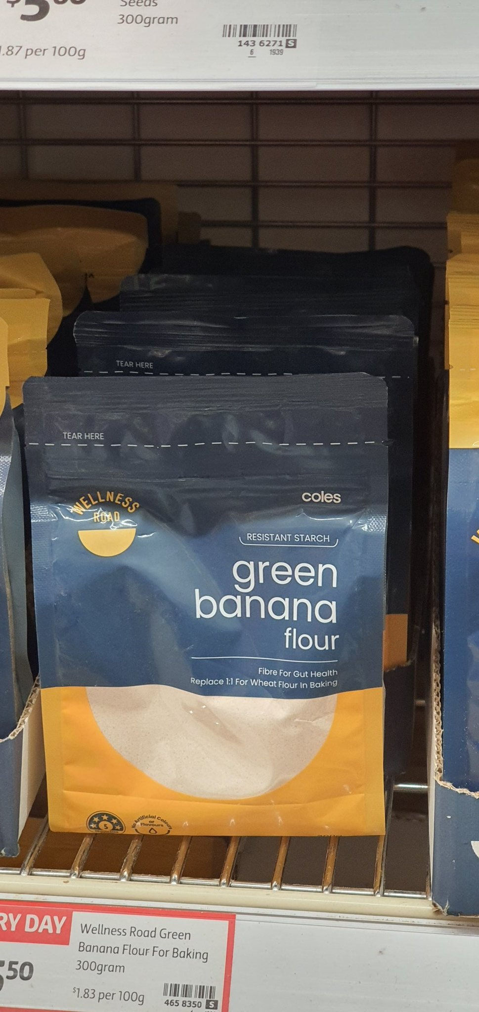 Close up of packet of green banana flour on a shelf in a Coles supermarket.
