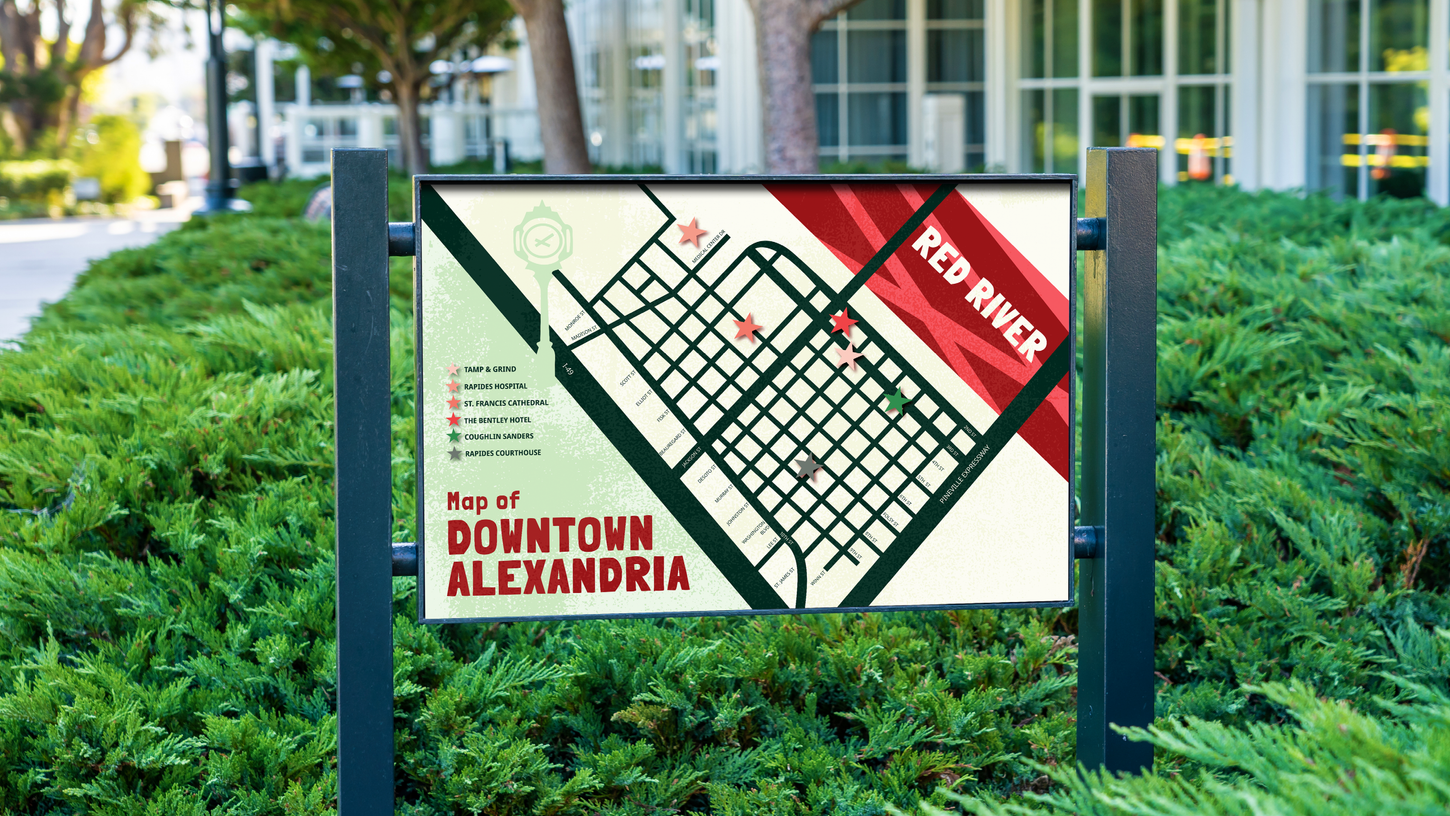 The Map of Downtown Alexandria presented on a large sign sitting in the grass for tourists to view