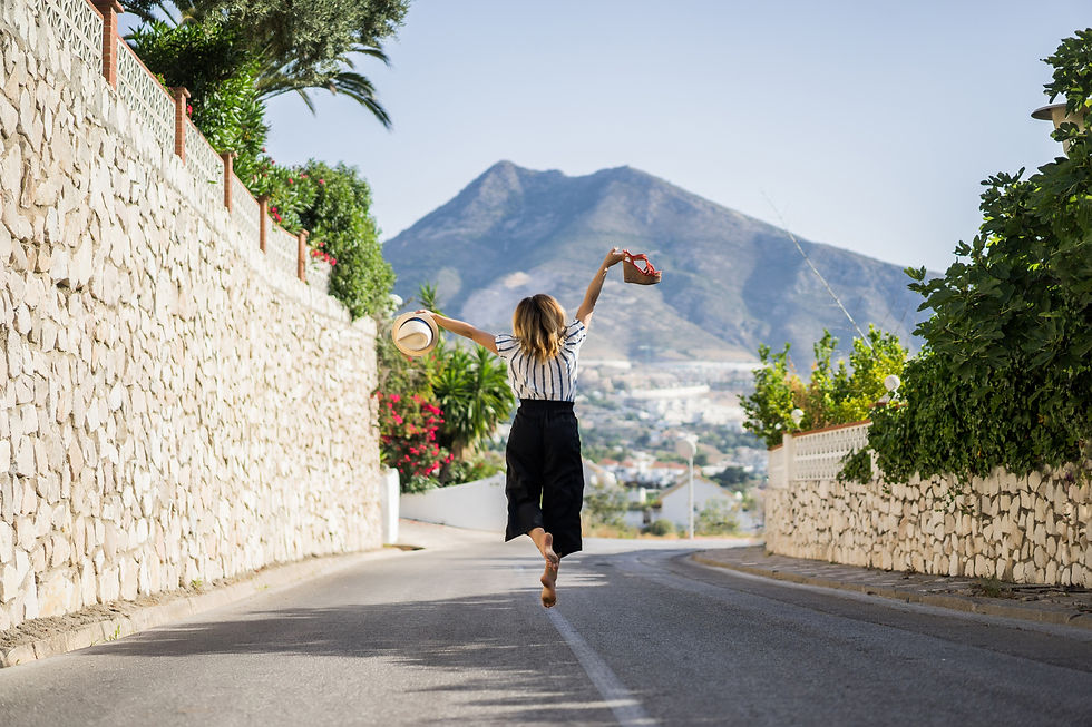 young-beautiful-woman-vacation-jumping-one-hand-sandals-second-hand-hat (1).jpg