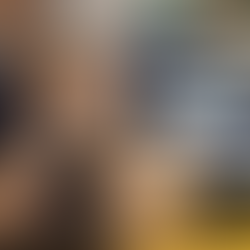 New Zealand police officer in uniform sitting with head in hands showing stress, while another officer looks on, highlighting the impact of PTSD and inadequate oversight on police families.