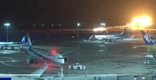 Passenger jet catches fire in Tokyo