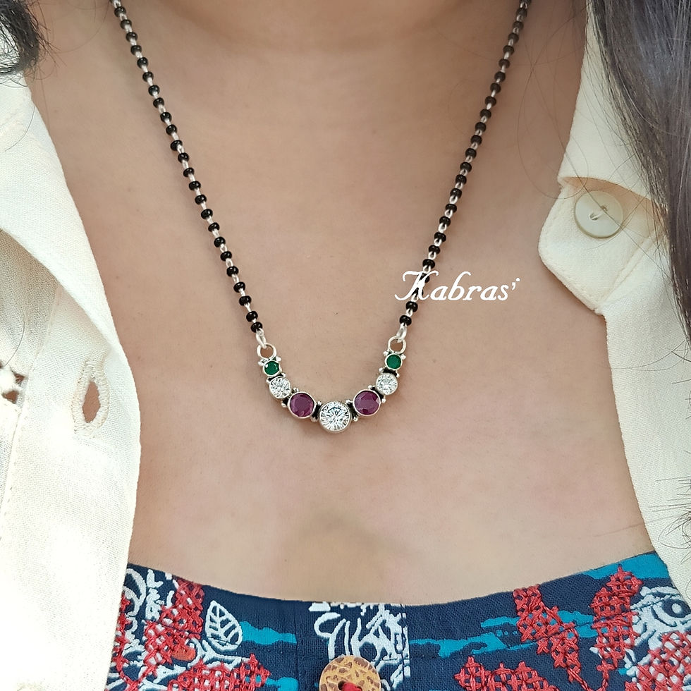 Short mangalsutra with black beads and gold pendant