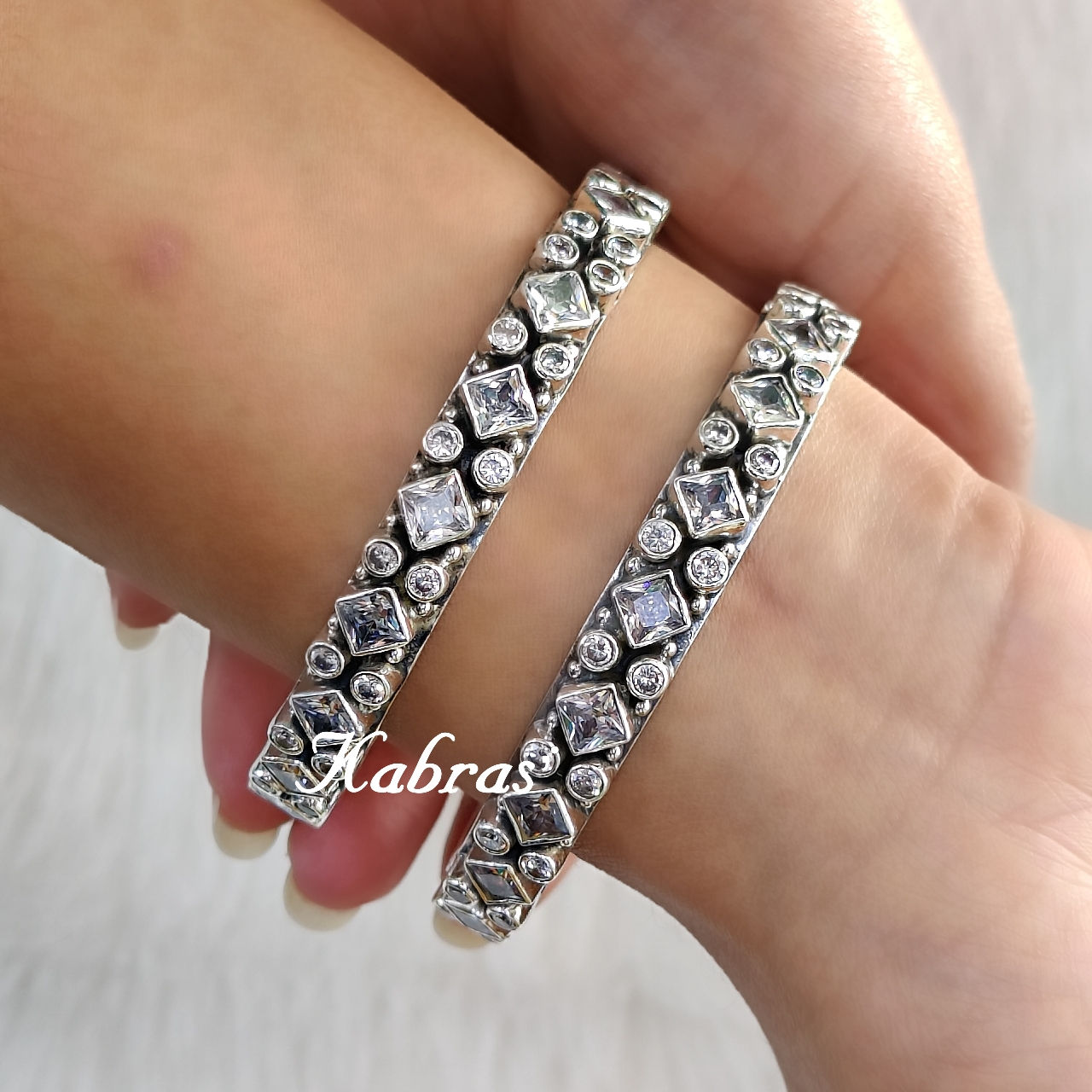 AD Square Dot 92.5 Silver Bangle studded with cut cubic zircons and heritage inspired. good for both ocaasion and everyday