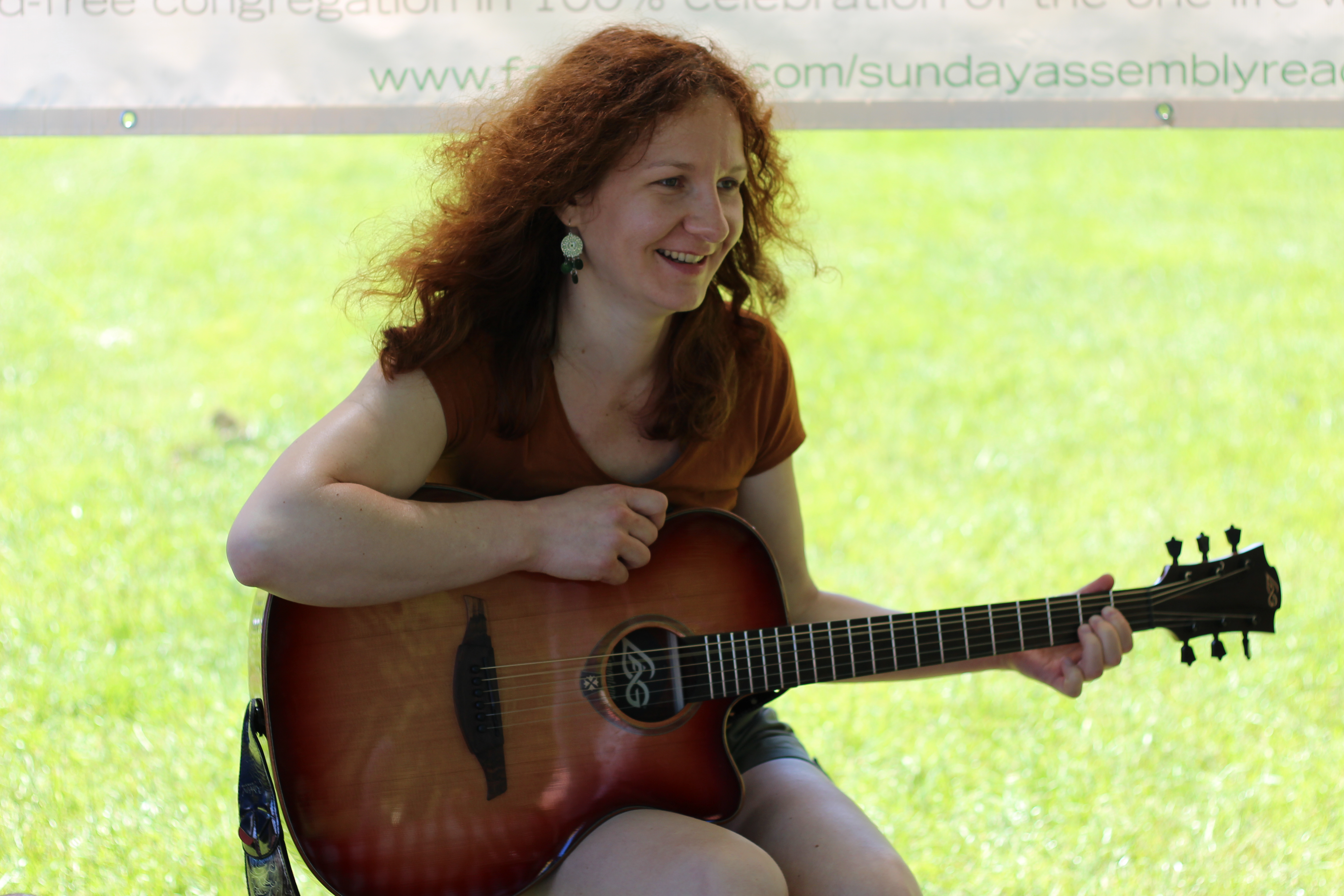 Ilona learns the strumming arts