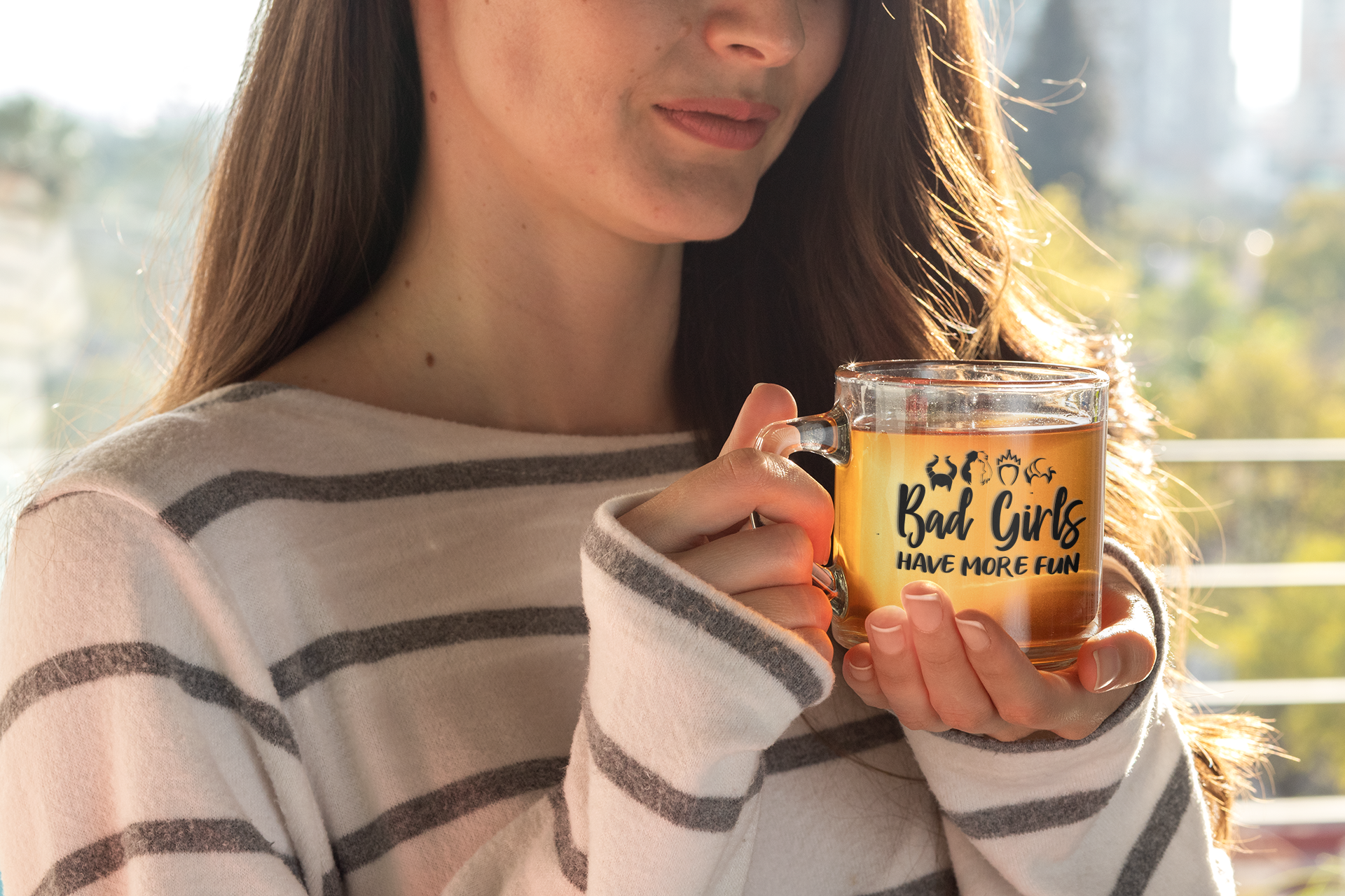 Woman holding 'Bad Girls Have More Fun' mug