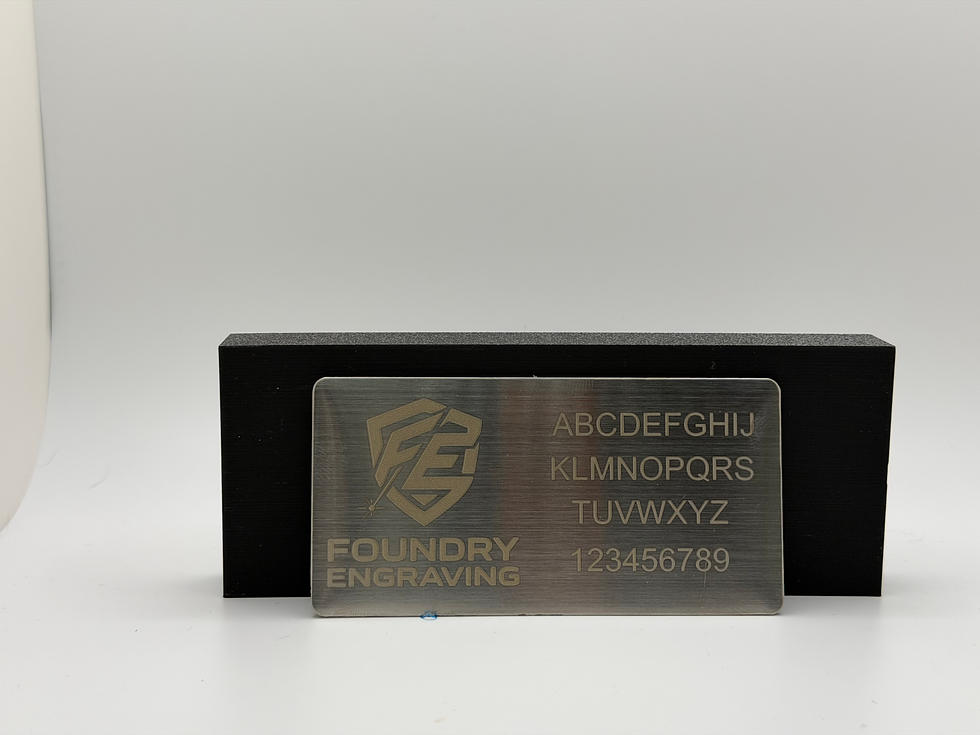 Laser engraved silver 4" x 2" name plate with rounded corners showing logo and text engraving sample