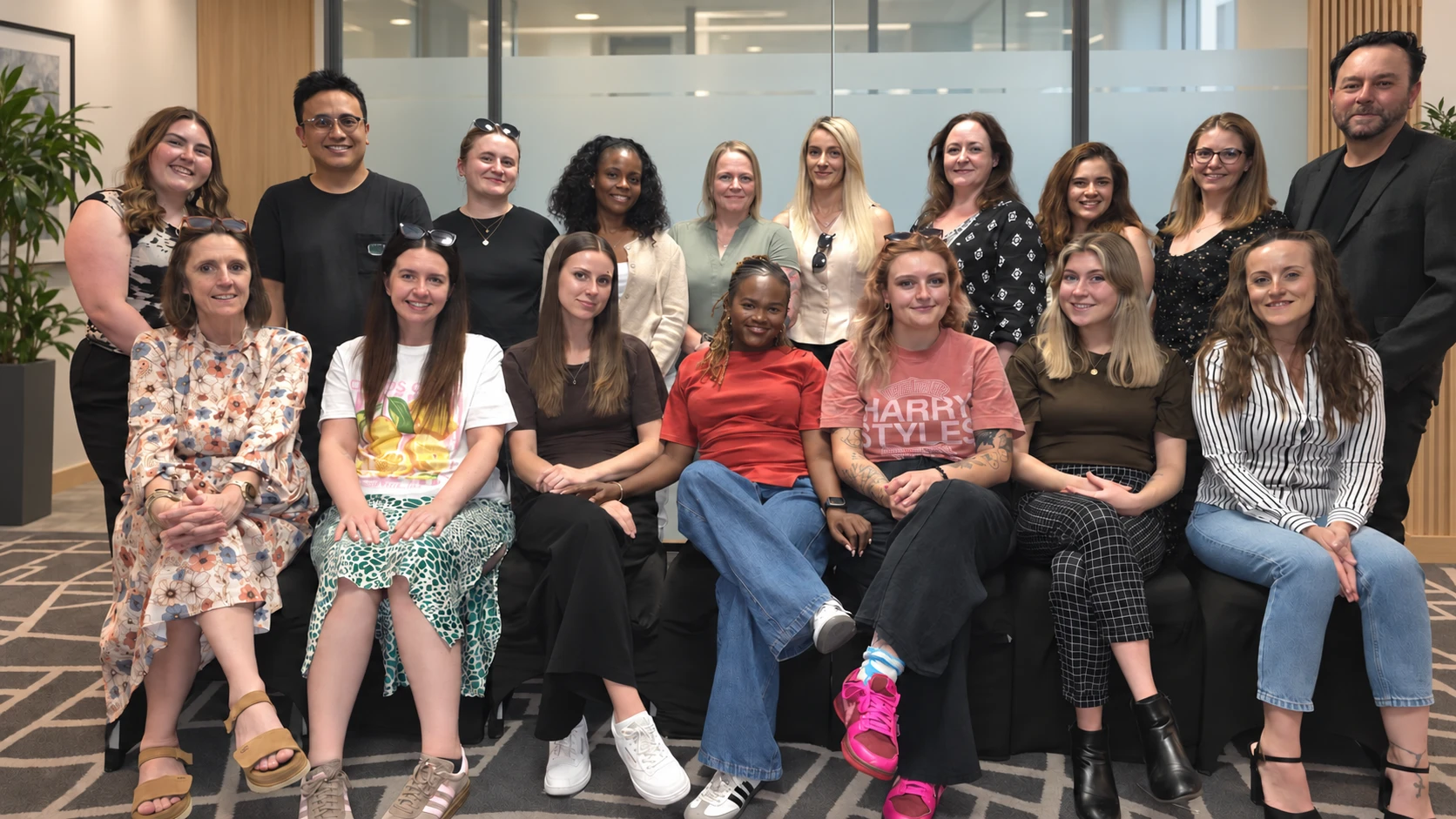 The Nellie Supports team together in a modern office