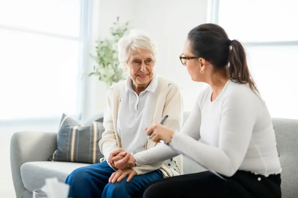 Woman signing lasting power of attorney document with family member present for support