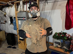 Upstate Duct Cleaning team member removing debris from hvac system