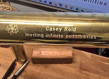 Personalized handmade brass kaleidoscope with custom engraving, a unique and elegant closing gift.