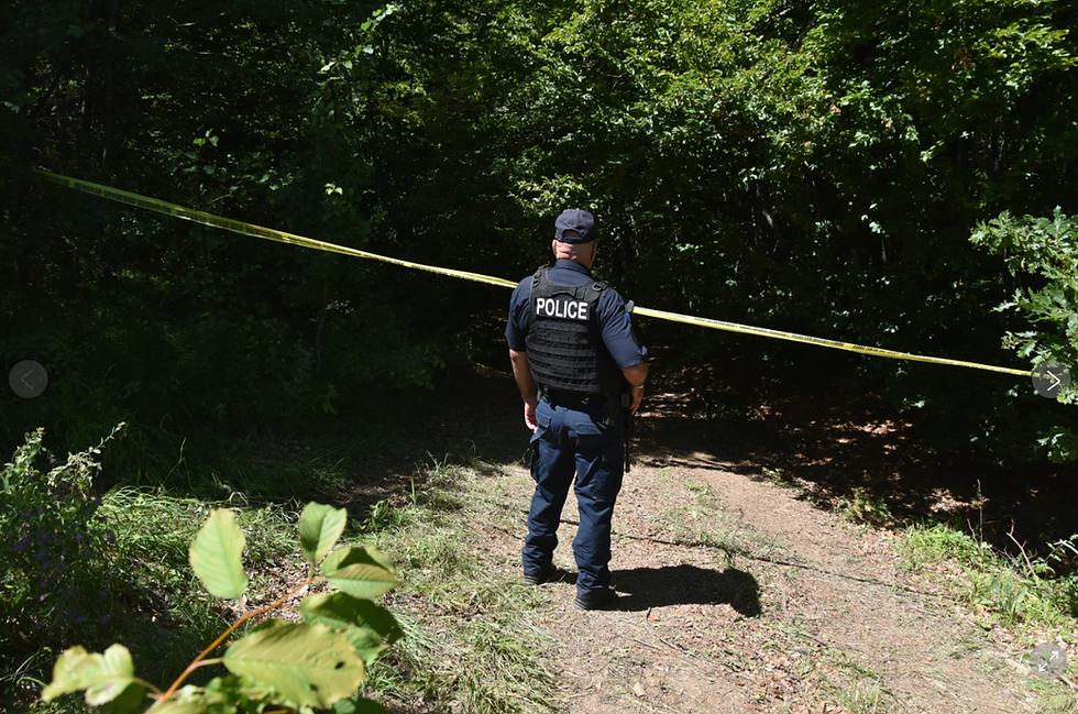 Forensic teams search a suspected mass grave from the Kosovo War