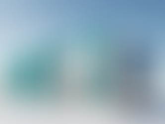 A sleek, modern small modular nuclear reactor featuring bright turquoise pipes and metallic exterior