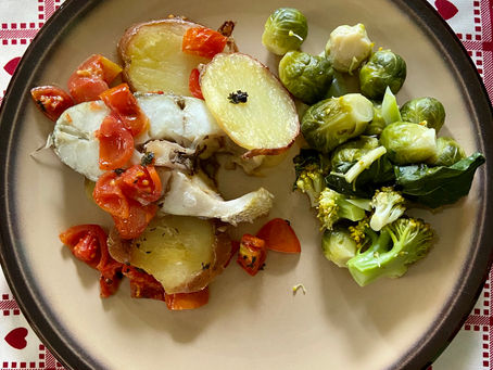 Baked umbrine slice withe tomatoes and potatoes
