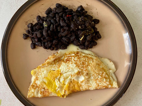 Early dinner, cheesy omelette with beans and fruits
