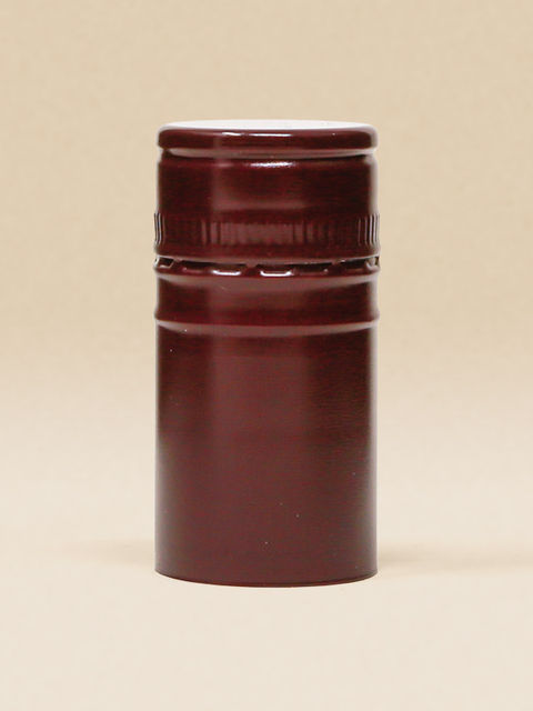 Rote ("Rojo Burdeas") BVS-Weinkapsel auf beigem Hintergrund