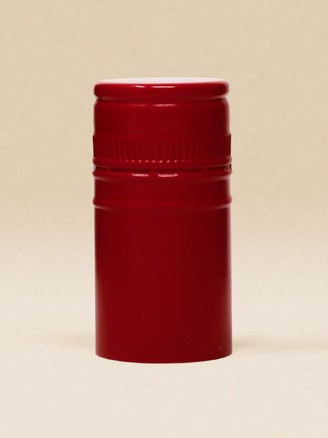 Rote ("Rojo Lava Brillo") BVS-Weinkapsel auf beigem Hintergrund