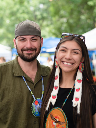 Two attendees smiling at the Tyendinaga Traditional Pow Wow