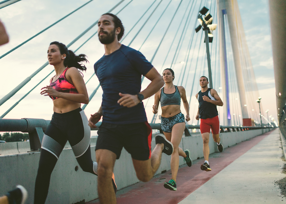 Runners running on a bridge during a 10k race