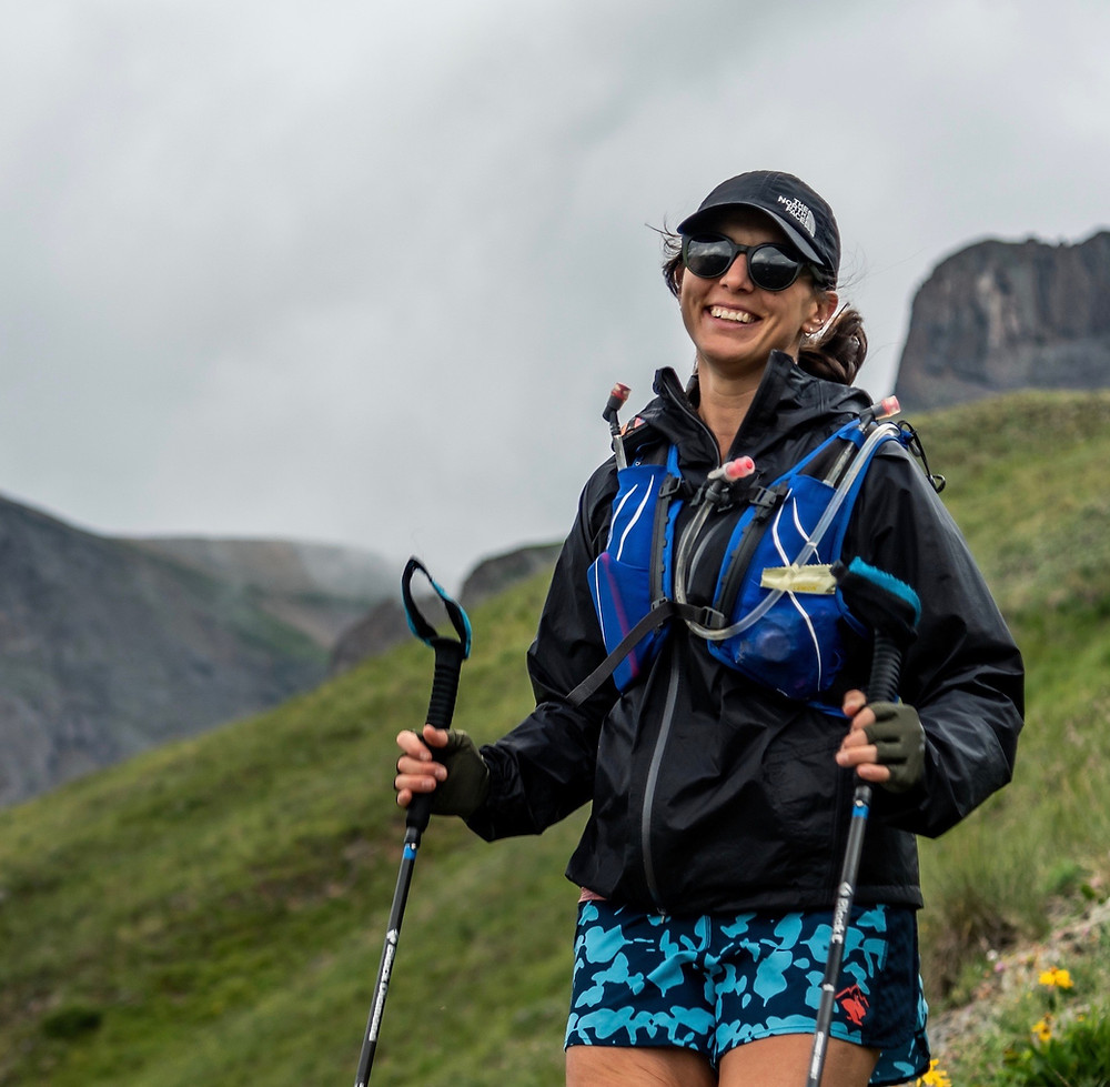 Ultrarunning Coach Julie smiling in the mountains