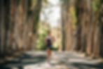 Coach Cory doing a tempo run on a wooded road