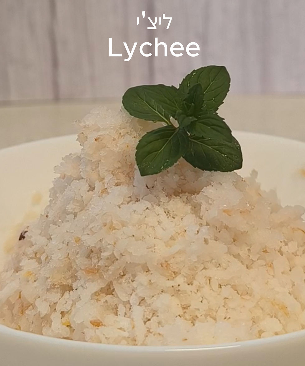 Shaved ice Lychee mint garnish in a white bowl, soft focus background. Text reads "Lychee" above in Hebrew and English.