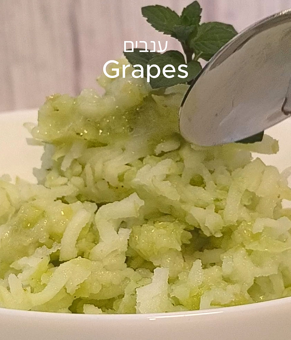 A spoon scooping green granita in a white bowl with mint garnish. Text reads "Grapes" in English and Hebrew. Light, refreshing mood.