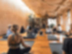 people in a small yoga class